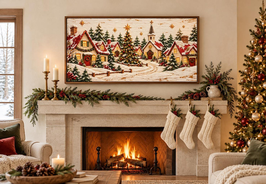 Cozy Christmas Village framed canvas wall art above a fireplace with stockings and a lit tree.