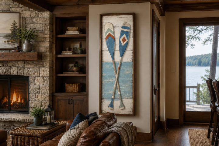 Tall narrow canvas wall art featuring two crossed weathered oars in a rustic lake house living room.