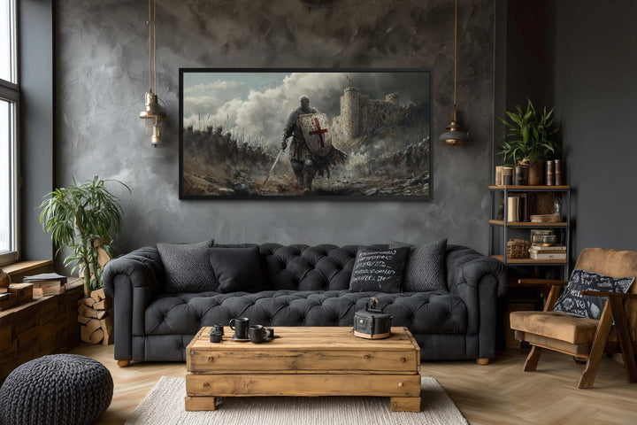 Extra large horizontal canvas print of a crusader knight in battle above a dark tufted sofa.