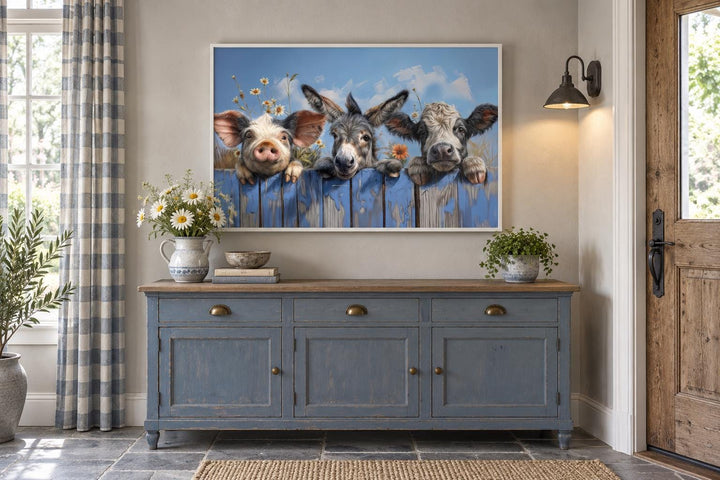 Cute farm animals donkey, pig, and baby cow looking over a blue fence framed canvas wall art.