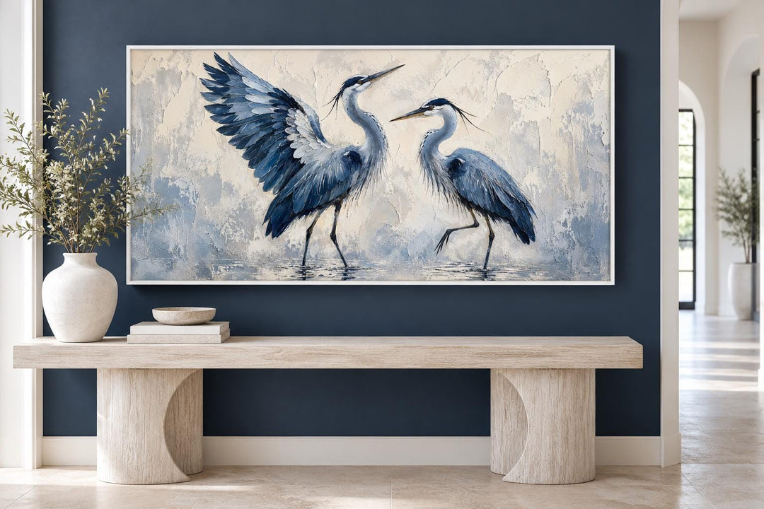Dancing Blue Herons canvas wall art featuring two birds in navy and cream on a textured background.