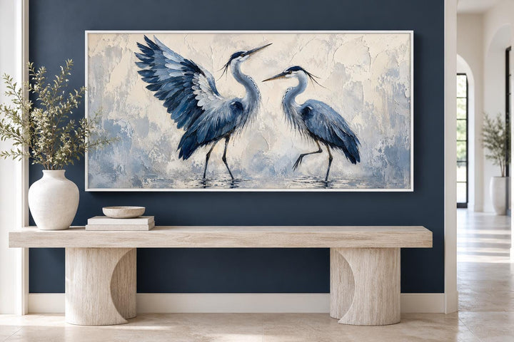 Dancing Blue Herons canvas wall art featuring two birds in navy and cream on a textured background.
