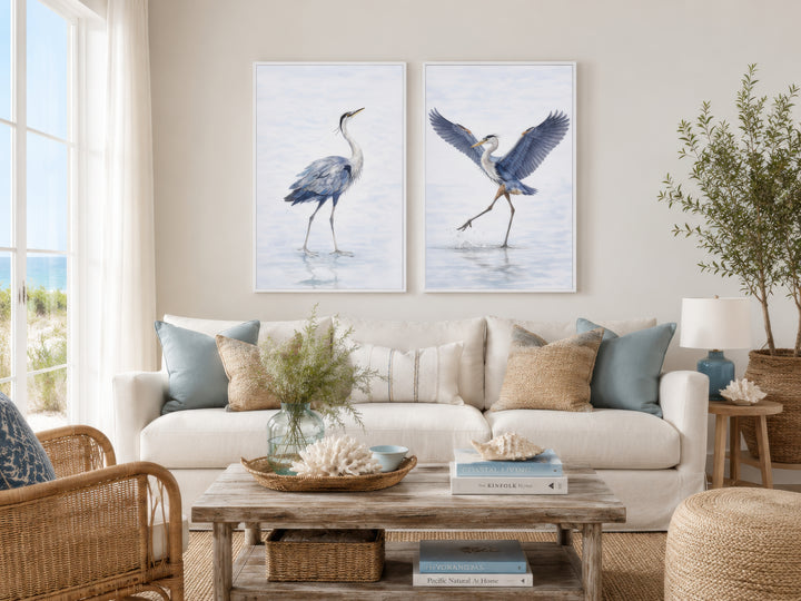 Set of two watercolor canvas prints featuring elegant blue herons in graceful, dancing poses.