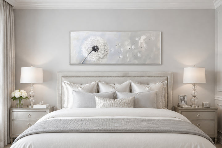 Dandelion boho grey and white long horizontal framed canvas wall art hanging above a bed.