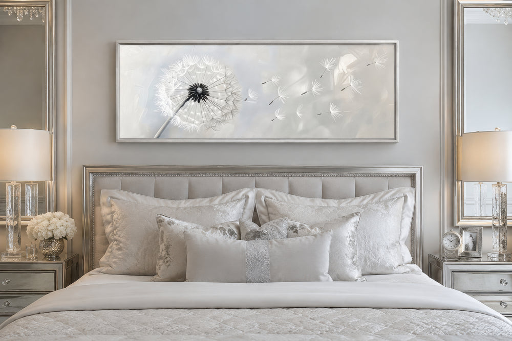 Dandelion boho grey and white long horizontal framed canvas wall art hanging above a bed.