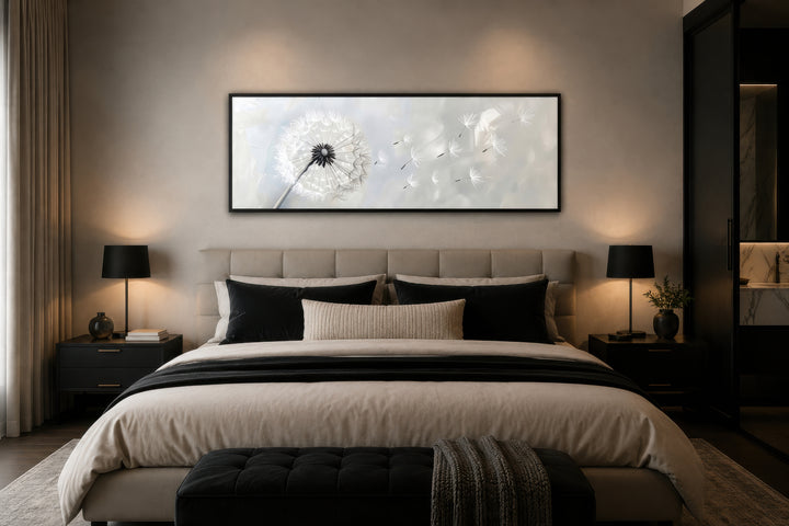 Horizontal framed canvas wall art featuring a white dandelion on a grey background above a bed.