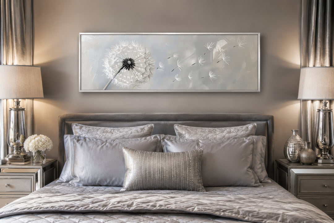 Framed horizontal canvas wall art featuring a white dandelion on a grey background above a bed.