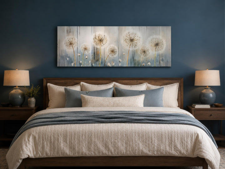 Long horizontal dandelion canvas wall art in a farmhouse bedroom above a wooden headboard.