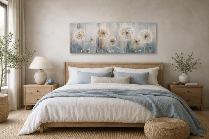 Long horizontal dandelion canvas wall art in a farmhouse bedroom with blue and cream bedding.