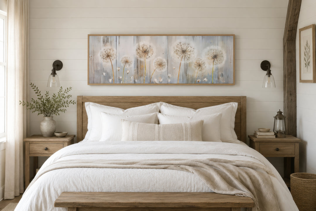 Horizontal canvas wall art featuring dandelions on distressed wood above a farmhouse-style bed.