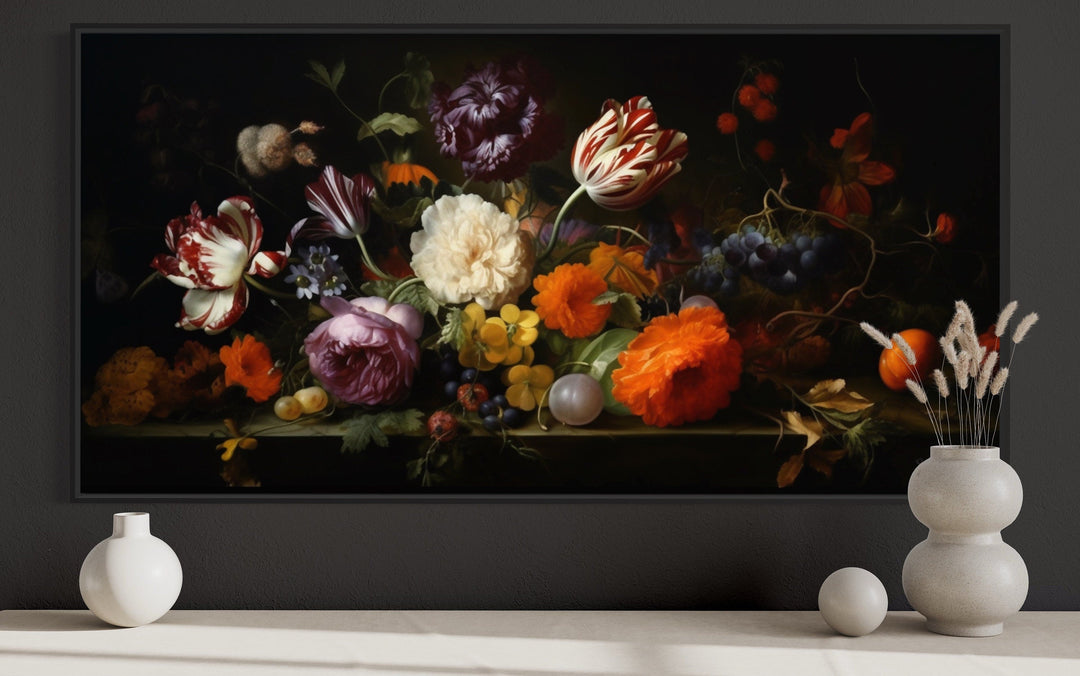 Framed dark academia floral canvas print above a mantel with white ceramic vases and decor.