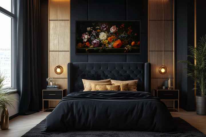 Antique floral print framed gothic canvas decor above a black tufted bed in a dark academia room.