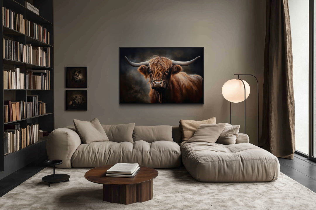 Dark Beautiful Highland Cow Framed Canvas Wall Art hanging above a modern sofa in a living room.