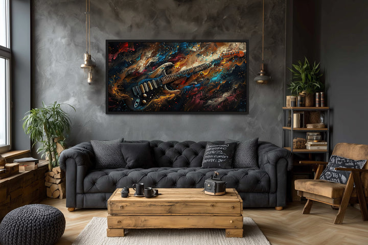 Dark colorful electric guitar framed canvas wall art in a modern music-themed living room.