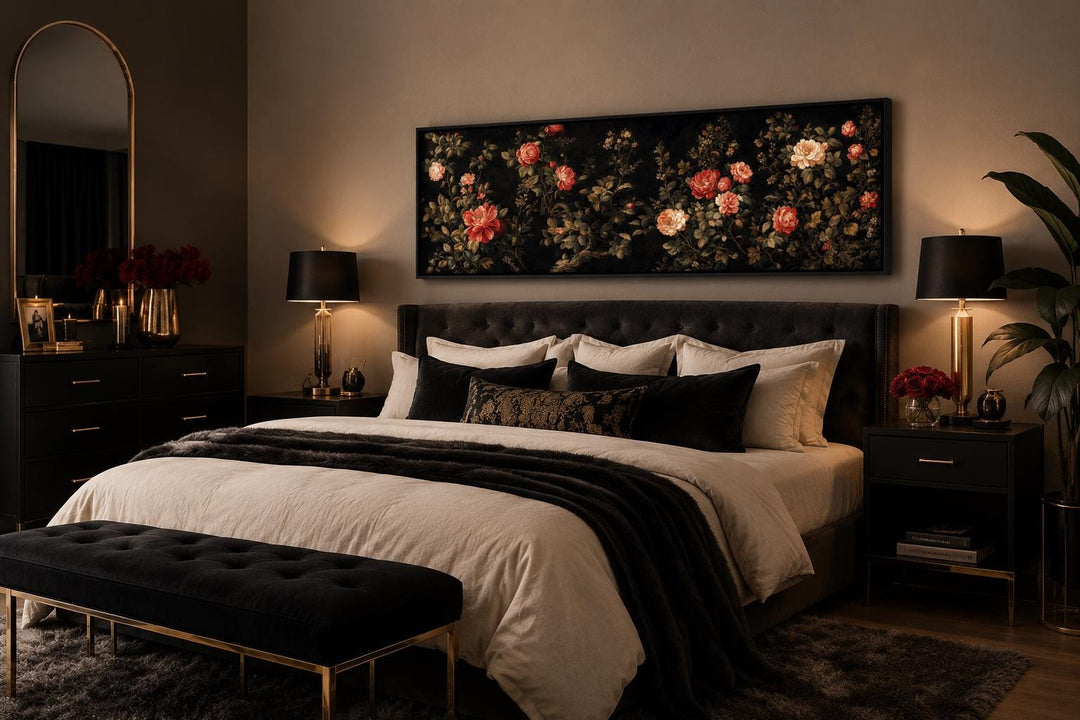 Long horizontal canvas art of red and cream roses on a black background above a bedroom headboard.