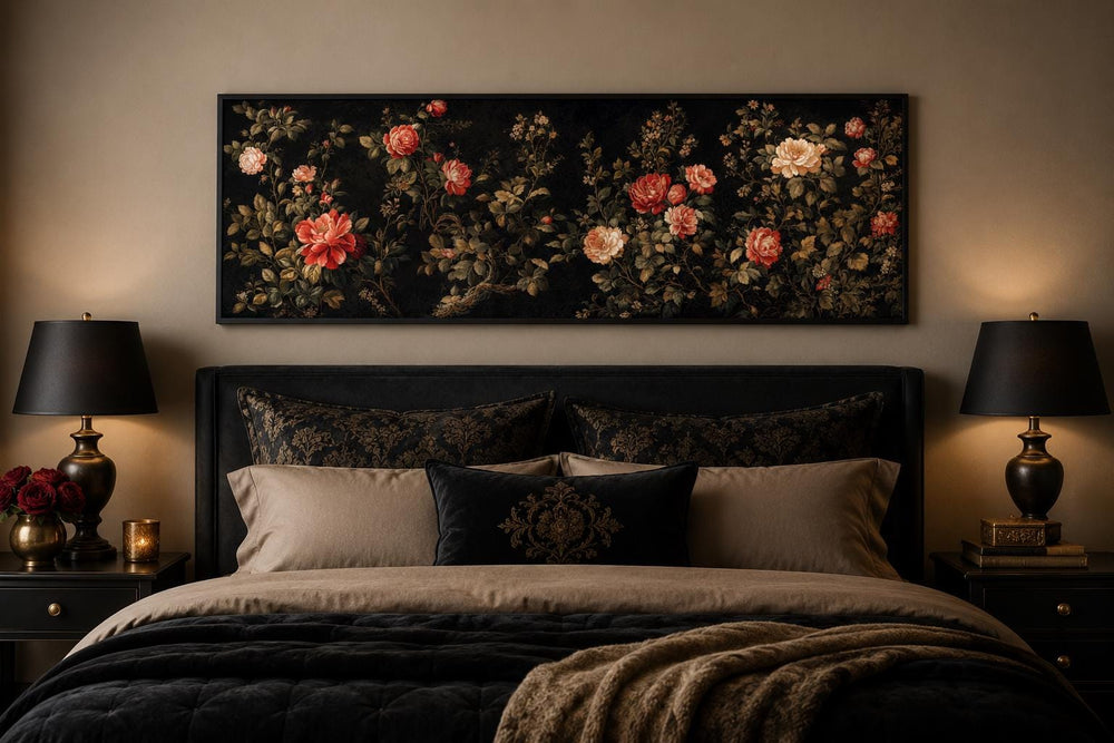 Long horizontal canvas art with red and cream roses on a black background above a bed.