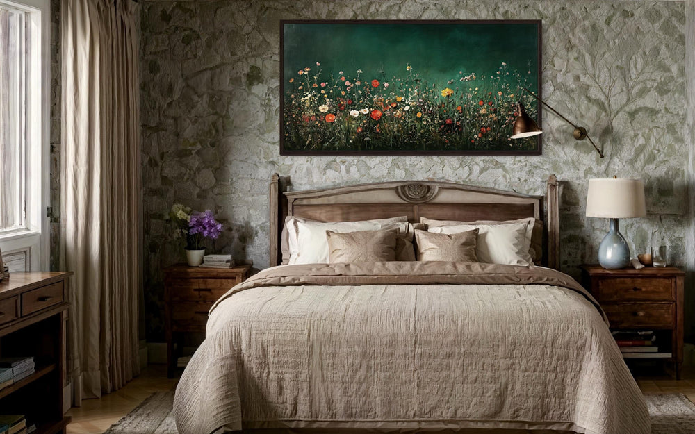 Dark moody green wildflowers field at night framed canvas wall art hanging above a bed.