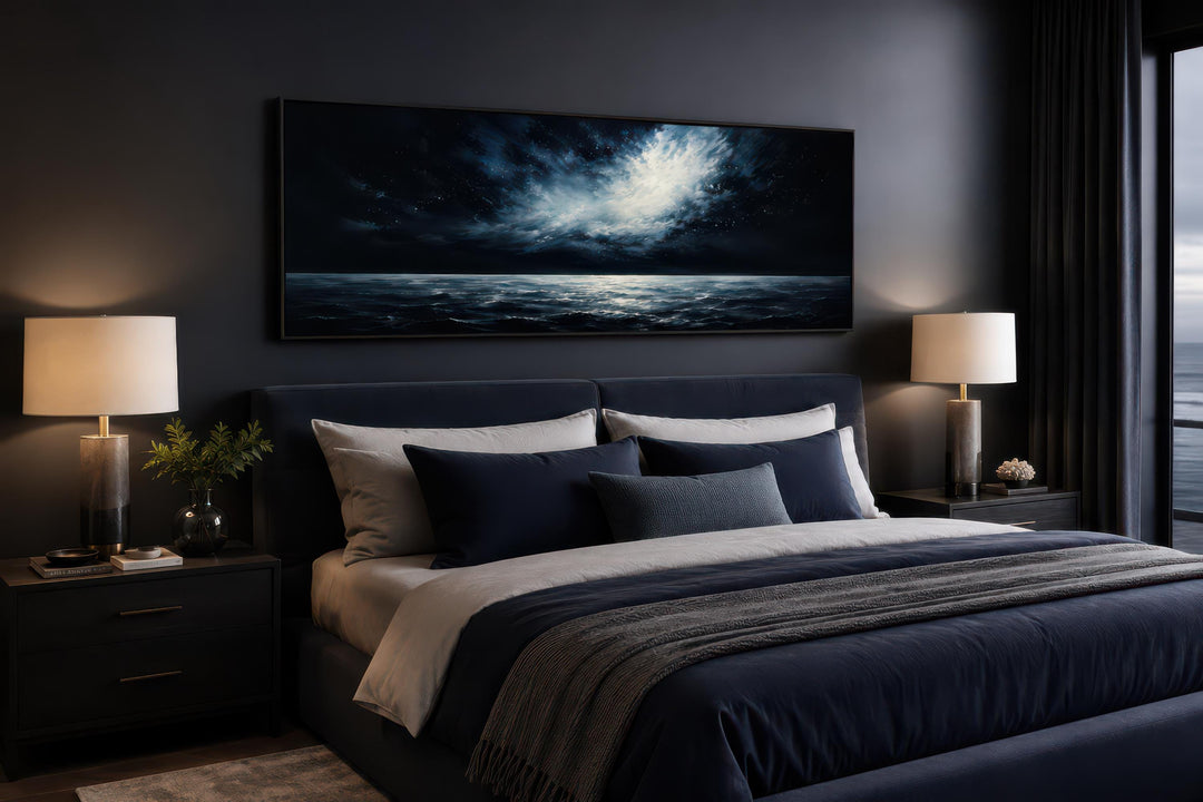 Wide horizontal canvas print of a moonlit ocean and stormy night sky above a dark navy bed.