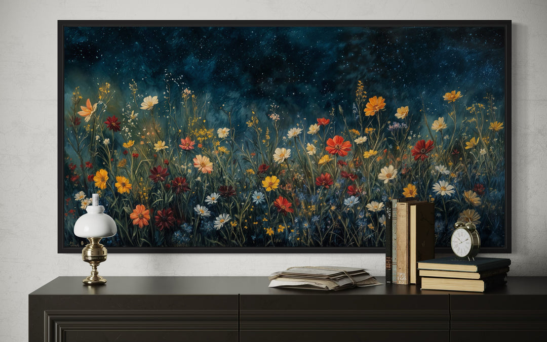 Framed canvas art of vibrant orange and red wildflowers under a dark blue starlit night sky.