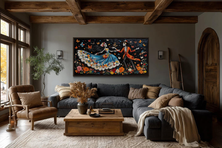 Day of the Dead dancing skeletons canvas wall art displayed in a rustic, modern living room.