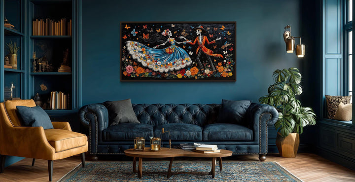 Day of the Dead dancing skeletons canvas wall art displayed in a dark teal living room.