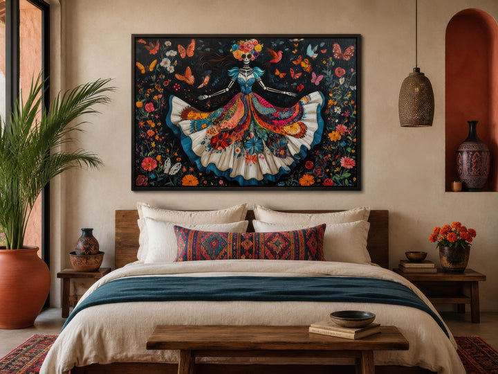 Day of the Dead wall art featuring a dancing Catrina canvas with a vibrant floral skull painting.