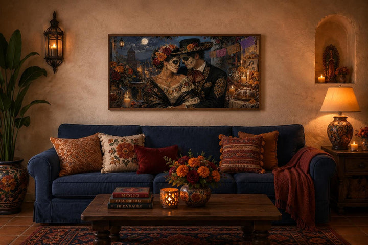 Day of the Dead canvas art of a romantic sugar skull couple above a blue sofa in a warm living room.
