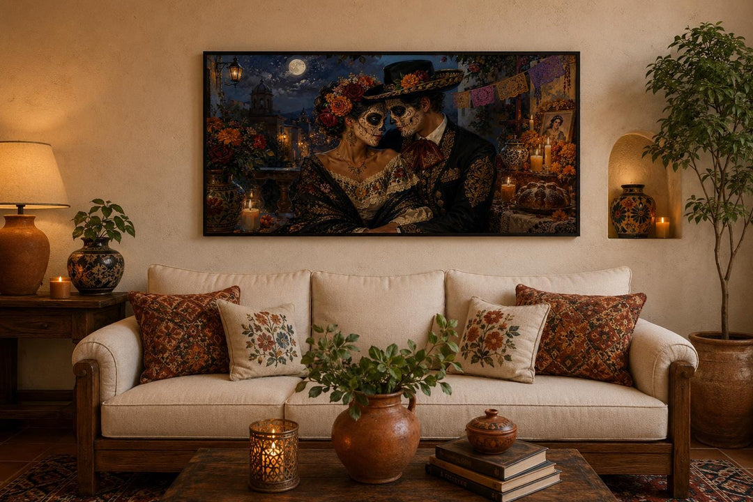Day of the Dead wall art featuring a romantic sugar skull couple on canvas above a living room sofa.