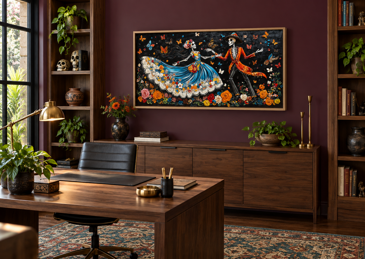 Day of the Dead dancing skeletons canvas wall art above a desk in a dark, moody office.