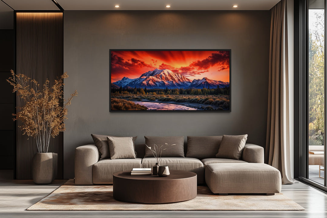Framed Denali National Park sunset canvas wall art above a modern sofa in a living room.