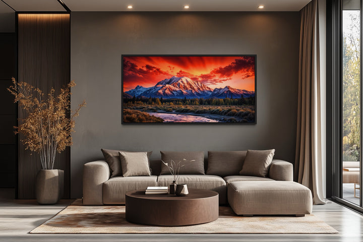 Framed Denali National Park sunset canvas wall art above a modern sofa in a living room.