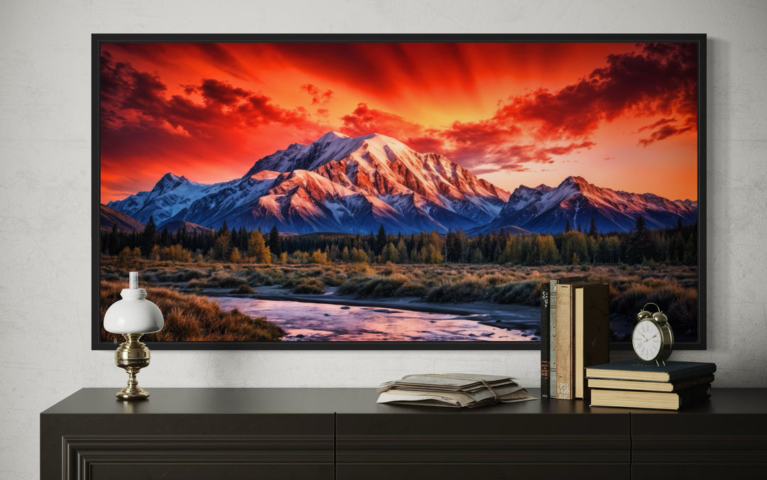 Framed Denali National Park wall art showing a vibrant sunset over snow-capped Alaskan mountains.