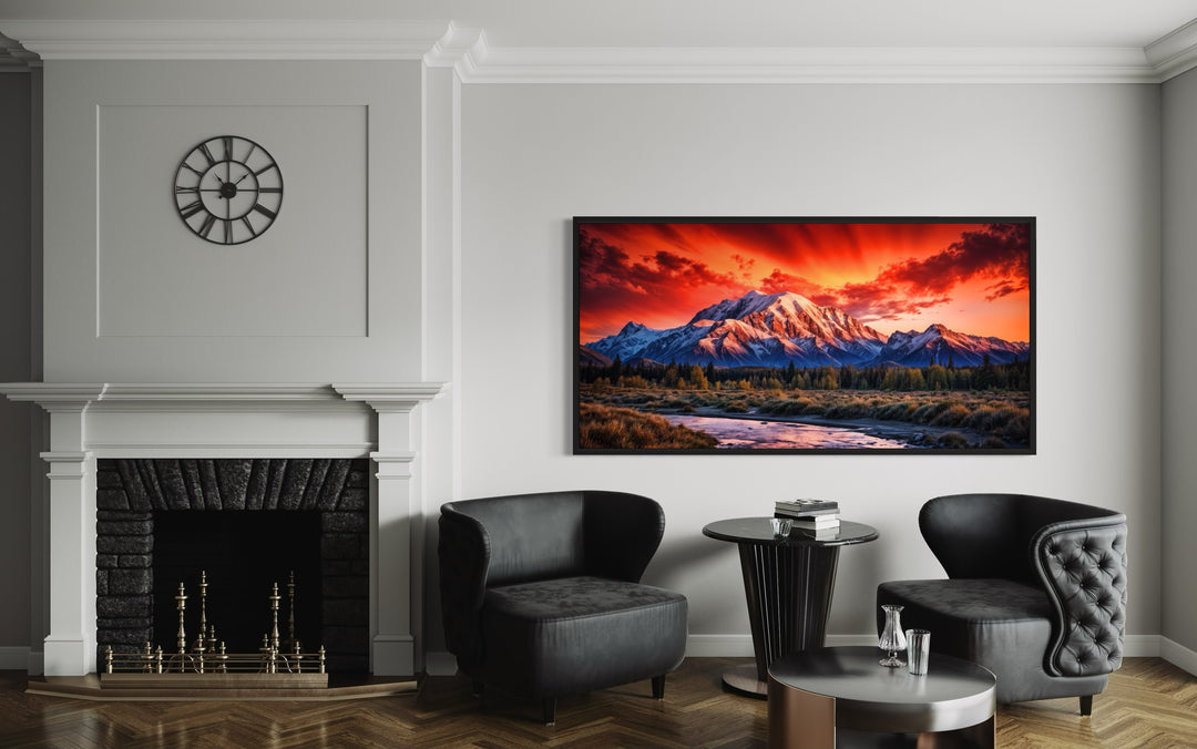 Framed Denali National Park sunset canvas wall art above a fireplace in a modern living room.