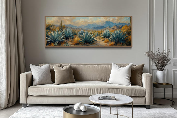 Desert agave long horizontal southwestern wall decor above a beige sofa in a modern living room.