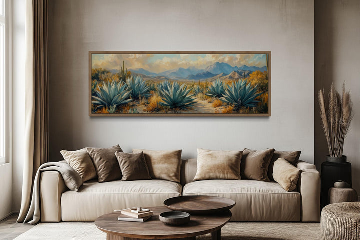 Desert agave long horizontal southwestern wall art above a neutral sofa in a modern living room.