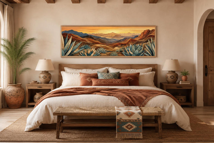 Wide horizontal canvas of a desert agave landscape in terracotta and teal above a bed.