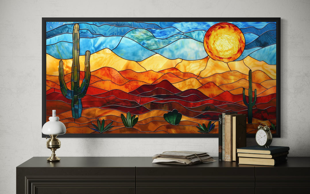 Framed stained glass style desert wall art with cacti and sun.