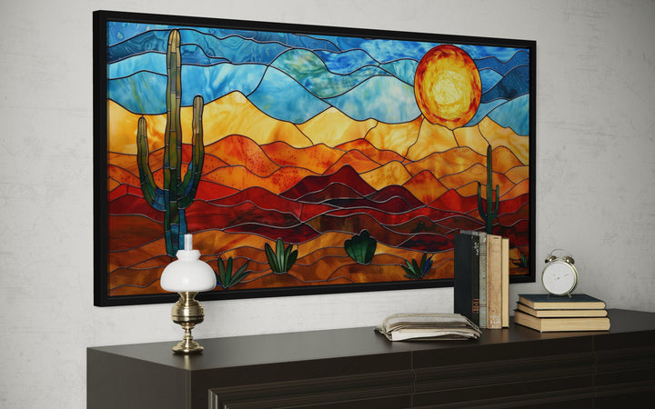 Framed desert wall art in stained glass style with cacti and sun.