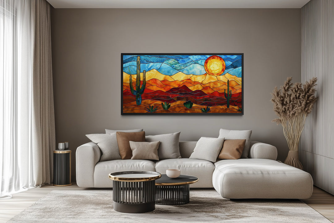 Framed stained glass style desert landscape wall art with cacti and sun.