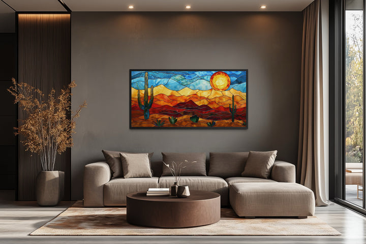 Framed canvas wall art with a stained glass style desert landscape.