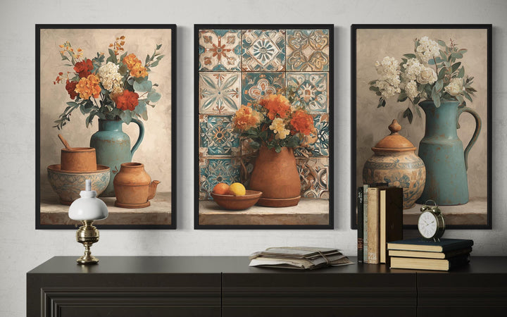 Set of 3 rustic canvas prints featuring floral arrangements in pottery on a dark wood sideboard.