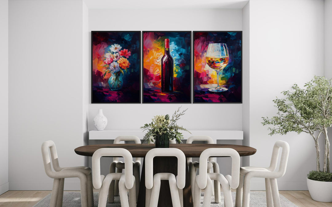 Set of three colorful canvas prints featuring a wine bottle, flower vase, and wine glass.