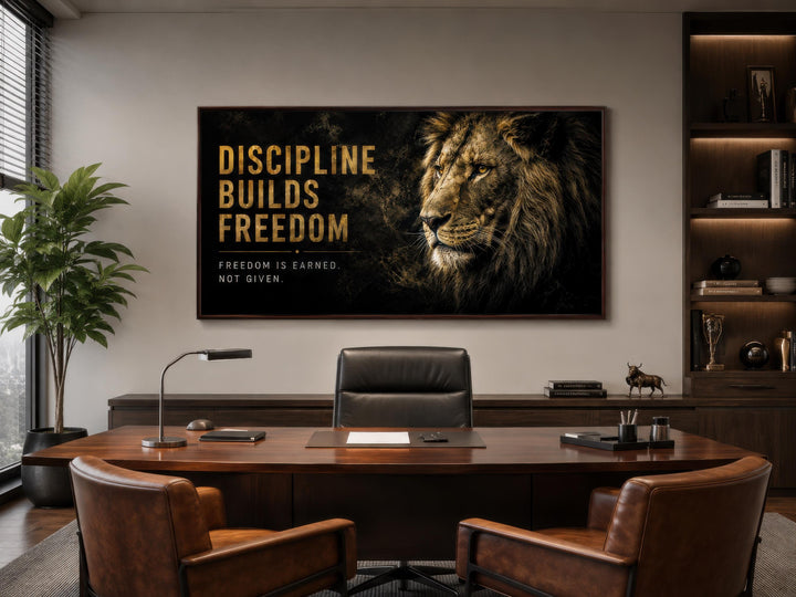 Discipline Builds Freedom motivational lion wall art in a black and gold canvas for a men's office.