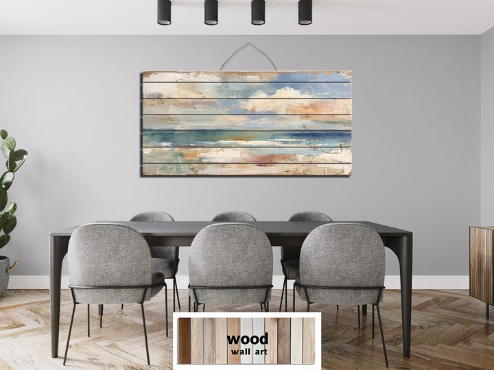 Distressed ocean horizon rustic wood wall art with soft blues, grays, and sandy tones.