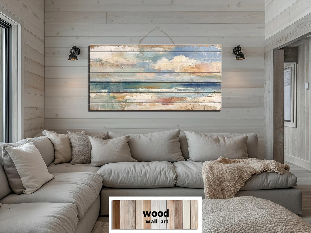 Distressed ocean horizon rustic wood wall art with soft blues and sandy tones.