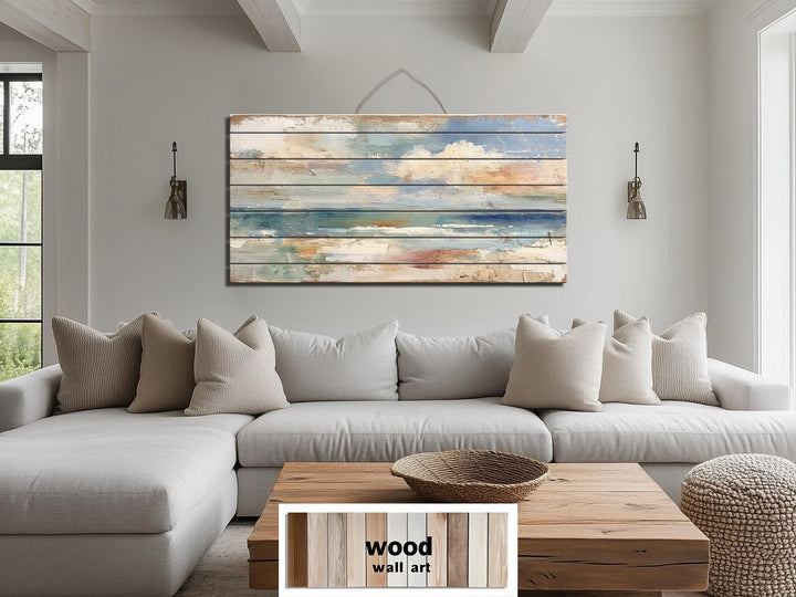 Distressed ocean horizon rustic wood wall art with soft blues and sandy tones.