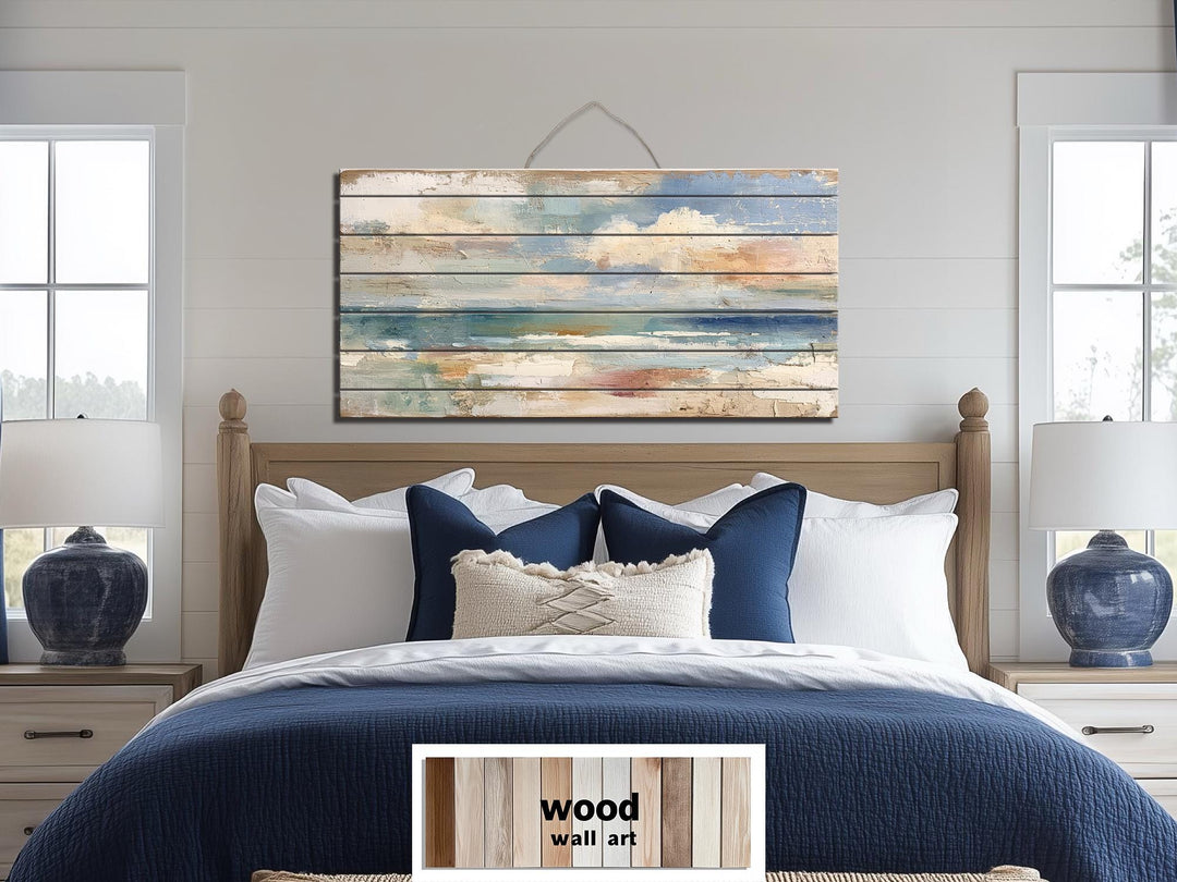 Distressed ocean horizon rustic wood wall art with soft blues, grays, and sandy tones.