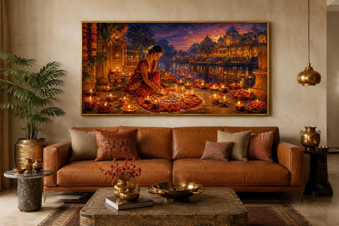 Diwali canvas wall art of a woman lighting diyas above a brown leather sofa in a living room.