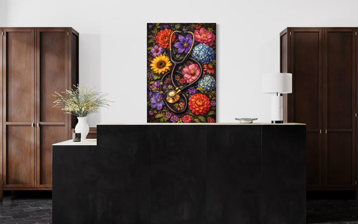 A floral stethoscope canvas print hangs on a wall above a modern black reception desk.