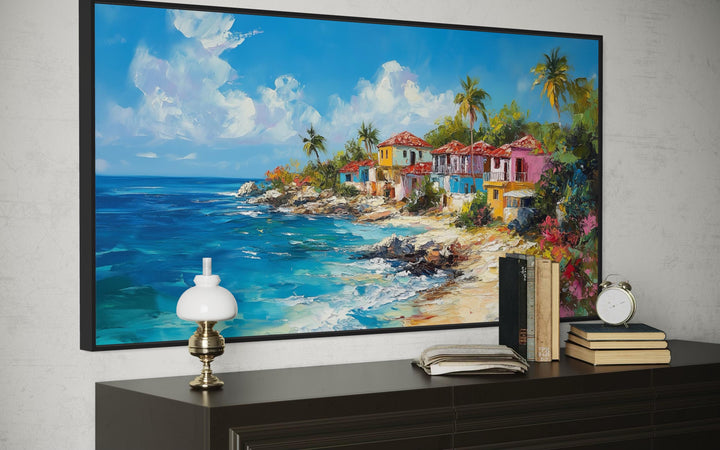 Dominican Republic beach painting canvas wall art above a dark dresser with a lamp and books.